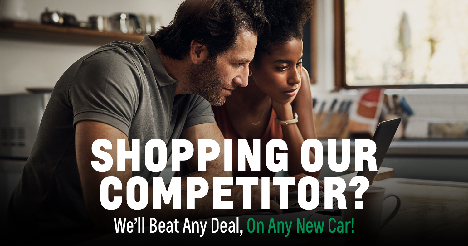 Customers looking at car prices on their computer