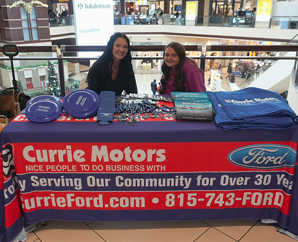 Currie Motors Community Involvement table at the mall